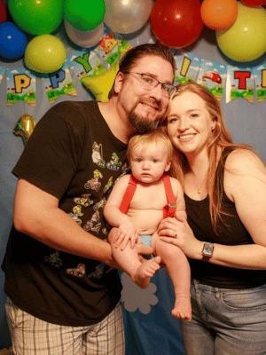 Barrett and fiancé, UMMC pharmacy technician Alexandria Hitt, with their one-year-old son, Wyatt