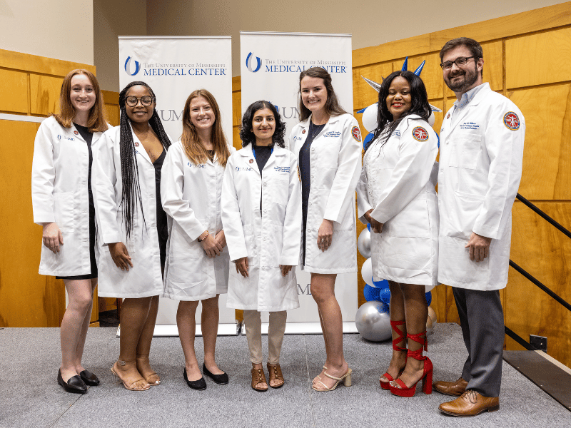 Williams, right, with his classmates in the first AuD class in the SGSHS. Jay Ferchaud/ UMMC Communications