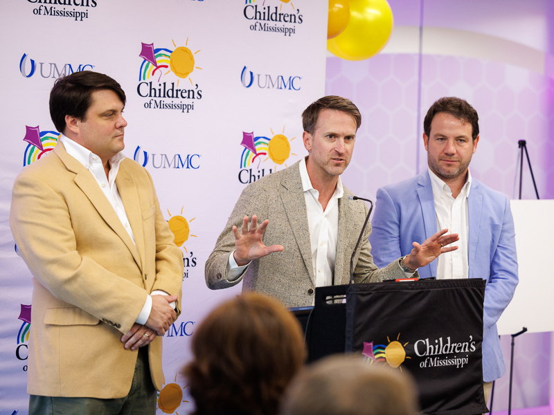 From left, Rene Louapre, co-founder of Hogs for the Cause; Becker Hall, co-founder and CEO; and Zandy Rainold, chairman of the board; tell about the festival's philanthropic mission.