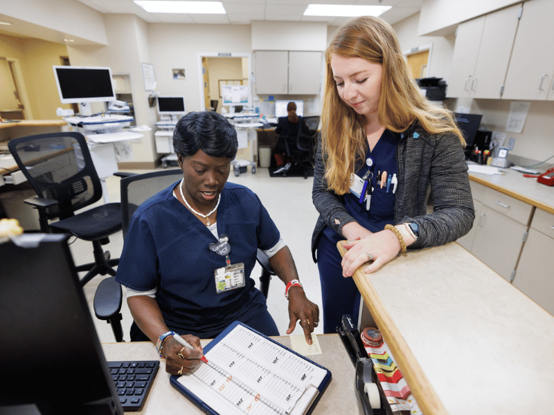 Patient Care Tech Lorraine Travis, left, and RN Annabelle Osborne are team members who contribute to exceptional quality care for inpatients.
