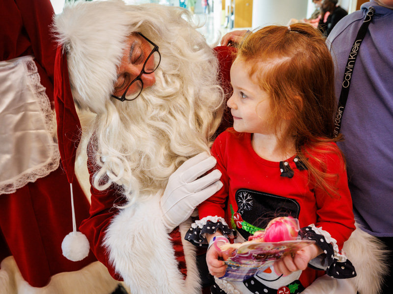 Landry McCoy of Marton gets a surprise from Santa during an outpatient clinic visit at Children's of Mississippi. Jay Ferchaud/ UMMC Photography