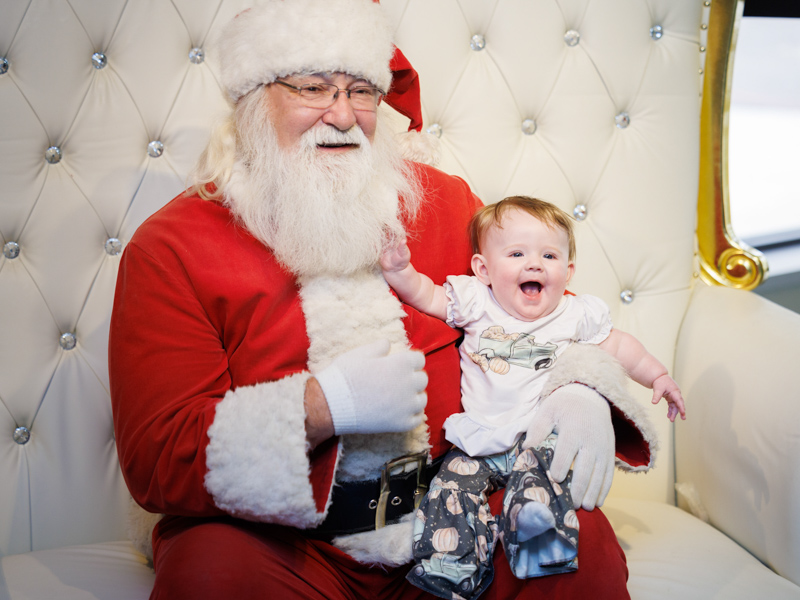Ava Cumberland of Philadelphia smiles with Santa during BankPlus Presents Winter Wonderland. Joe Ellis/ UMMC Photography 