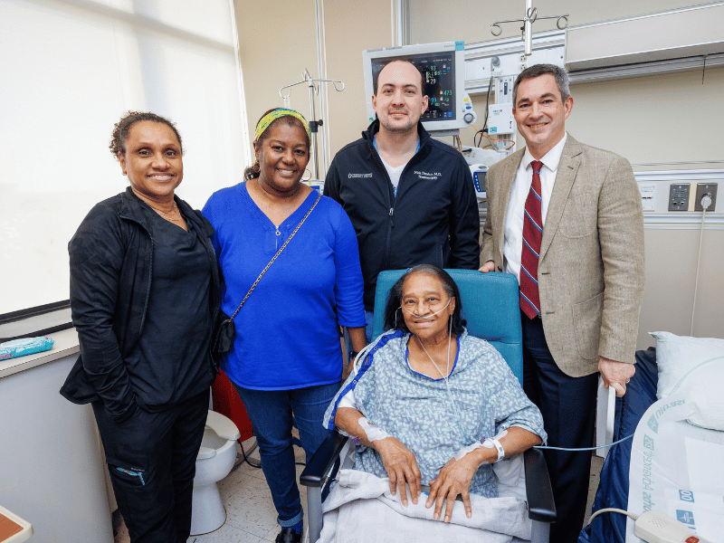 Bankston smiles, surrounded by her [from left] cousin and UMMC nurse, Andrealisa Johnson; niece, Trina Patton Toles; and surgeons, Dr. Nick Derrico and Dr. Chad Washington.
