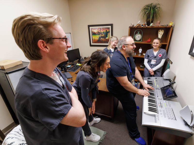 Dr. Sam Dickinson laughs with accelerated nursing students, from left, Wiltz Cutrer, Morgan Wallis, Ainsley Betcher and Emma Beebe after class.