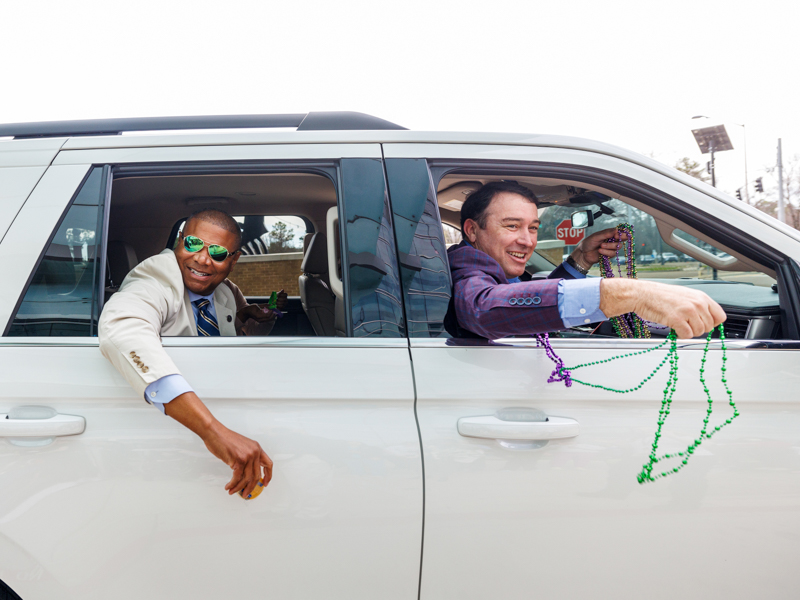 Mississippi Commissioner of Public Safety Sean Tindell, right, prepares to fling beads during the Department of Public Safety's annual Mardi Gras parade at Children's of Mississippi.