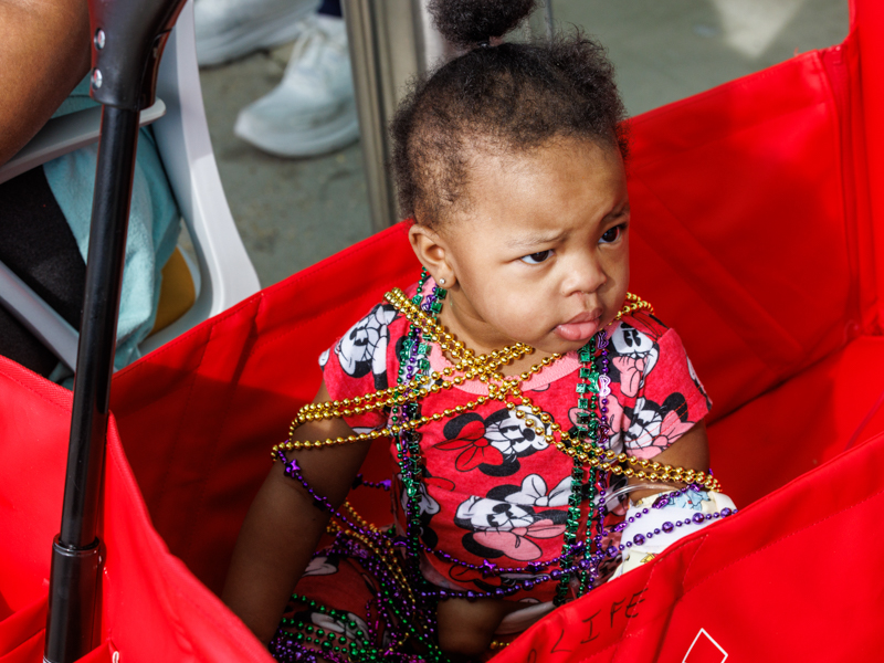 Children's of Mississippi patient Brielle Mays of Jackson got loads of Mardi Gras beads during the annual parade.