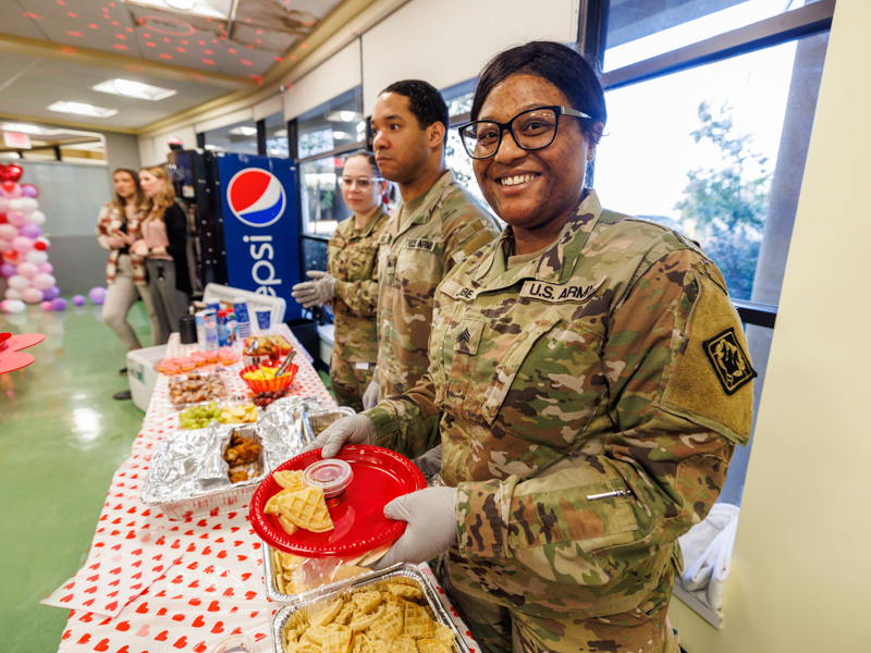 Sgt. Paula Jobe and fellow Mississippi National Guard members brightened Valentine's Day at Children's of Mississippi by hosting brunch for hospital inpatients. Jay Ferchaud/ UMMC Photography