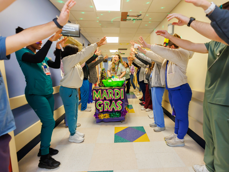 The Children's of Mississippi care team welcomes the Friends of Children's Hospital Mardi Gras parade. Melanie Thortis/ UMMC Photography