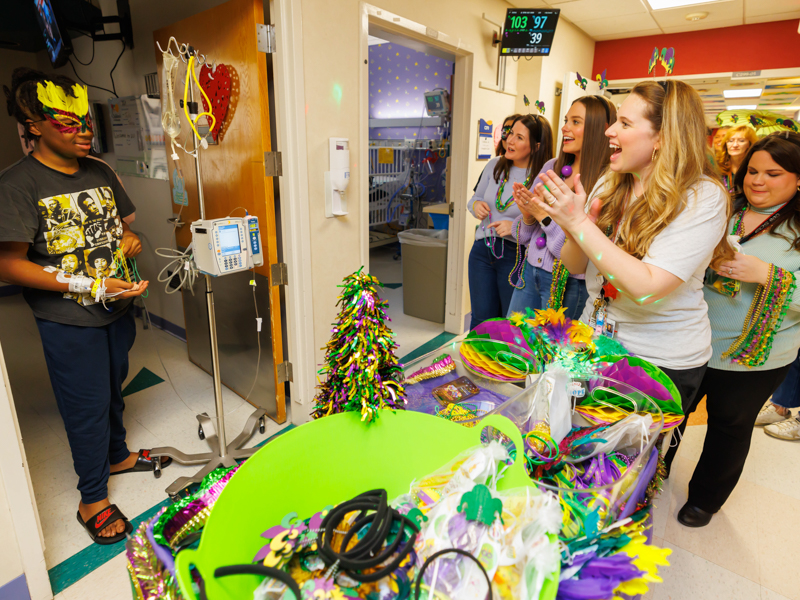 Children's of Mississippi patient Zielyn Harris of Canton is greeted with a Friends of Children's Hospital Mardi Gras parade. Melanie Thortis/ UMMC Photography 