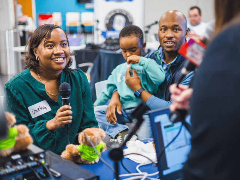 Courtney Gilner of Madison, mom of Children's of Mississippi patients Jackson and Harper, not pictured, tells her family's story during Mississippi Miracles Radiothon.