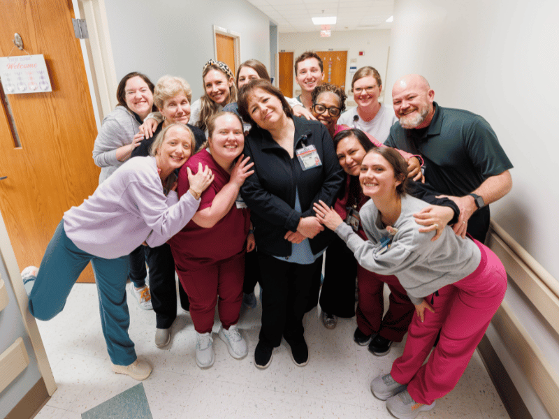 Farris poses with members of her team.