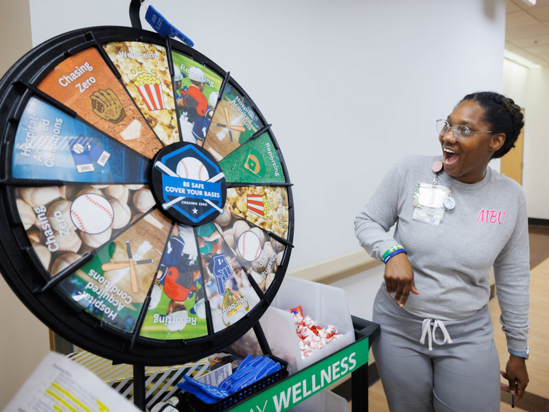 Unit Secretary Kim White reacts to her spin on the Safety Wheel on 3 Wiser. Joe Ellis/ UMMC Photography 