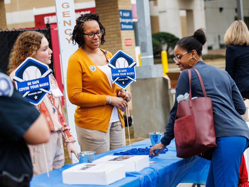 Registered Nurse Ashley Taylor is greeted in front of Wiser Hospital for Women and Infants by Adrienne Murray, director of nursing quality, development and professional practice, and Registered Nurse and Educator Valerie Stingley as part of Patient Safety Week. Melanie Thortis/ UMMC Photography 