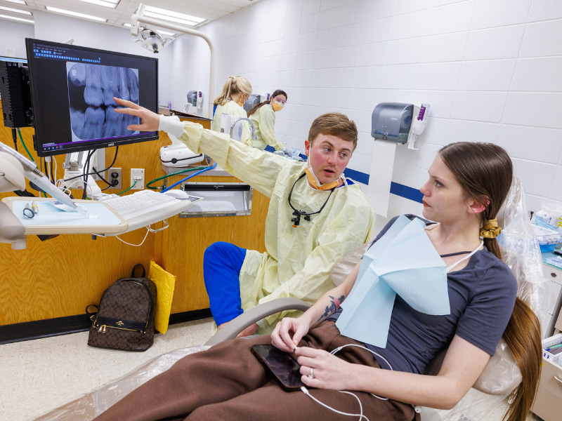 Savage explains treatment options to patient, Rachael Gill.