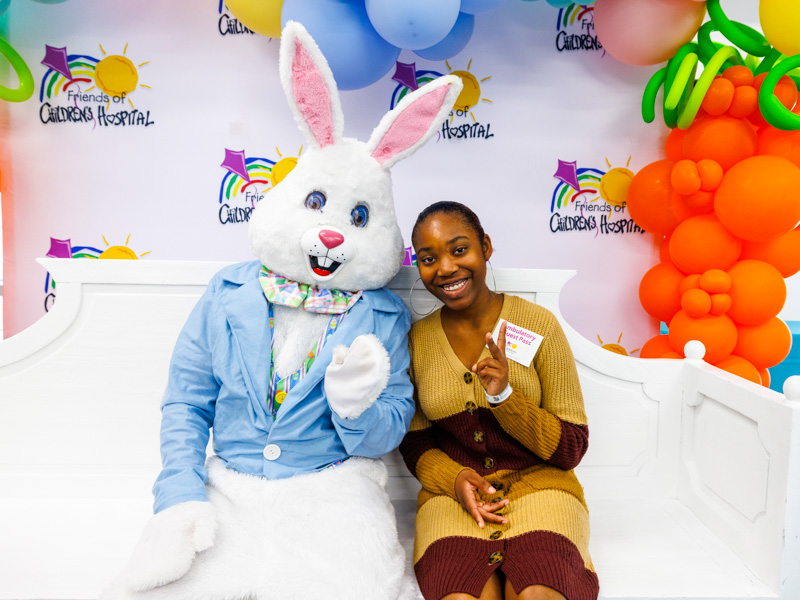 Madison McLaurin of Ridgeland smiles with the Easter Bunny during a Friends of Children's Hospital visit to Children's of Mississippi.