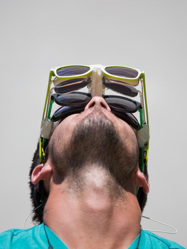 In this file photo taken on the UMMC campus, an observer of the Aug. 21, 2017 solar eclipse has donned several layers of eye protection. UMMC ophthalmologists advise observers to take in today's eclipse indirectly or with handheld viewers and solar eclipse glasses from reputable vendors.