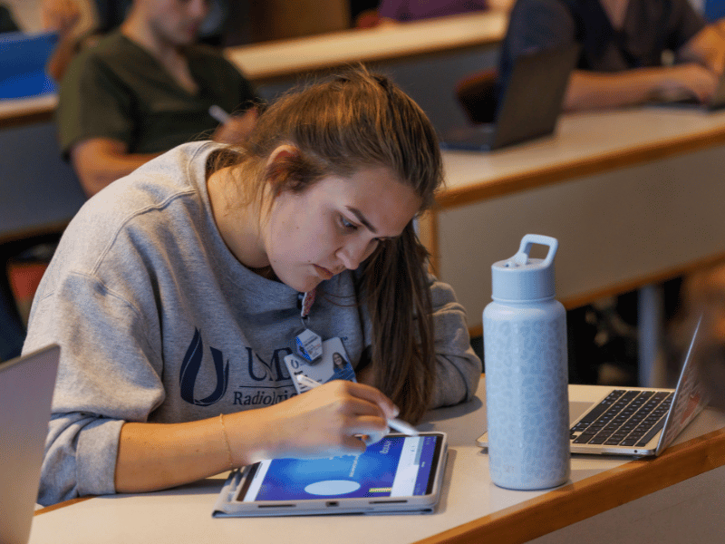 Megan Espinoza, a Radiologic Technology student, takes notes on her iPad using the Nearpod classroom format. Melanie Thortis/ UMMC Communications