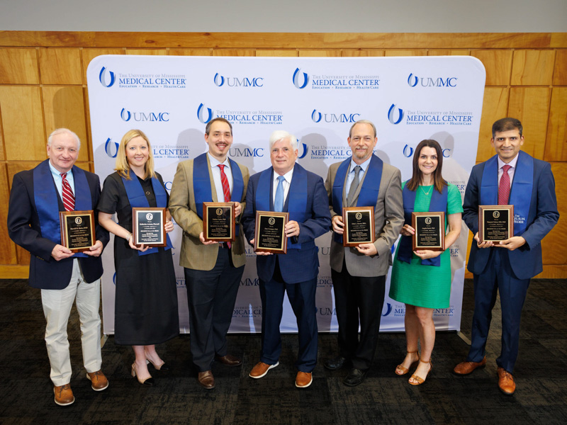 The TEACH Prize finalists, with winner Dr. Joey Granger, center, professor physiology and biophysics, are Dr. Darrell “Mitch M. Hutto, associate professor of care planning and restorative sciences; Dr. Katherine Artman, clinical assistant professor of pharmacy practice, University of Mississippi; Dr. Nathan Tullos, associate professor of advanced biomedical education; (Granger); Dr. Ottis “Lee” Brown, associate professor and program director, Radiologic Sciences Traditional Program; Dr. Angela Duck, associate professor of nursing; and Dr. Vinayak Nahar, associate professor and director of clinical research, Department of Dermatology.