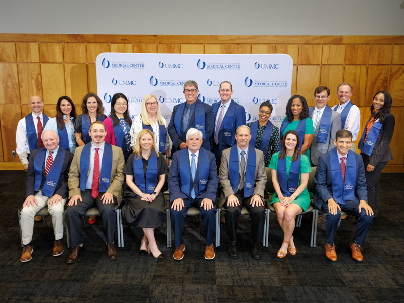 Nelson Order inductees and their nominating schools are front row, from left: Dr. Darrell “Mitch M. Hutto, School of Dentistry; Dr. Nathan Tullos, School of Medicine; Dr. Katherine Artman, University of Mississippi School of Pharmacy; Dr. Joey Granger (TEACH Prize winner), School of Graduate Studies in the Health Sciences; Dr. Ottis “Lee” Brown, School of Health Related Professions; Dr. Angela Duck, School of Nursing; and Dr. Vinayak Nahar, John D. Bower School of Population Health; back row, from left: Dr. Jonah Gunalda, School of Medicine; Dr. Susie Phillips, School of Medicine; Dr. Elizabeth Lutz, School of Medicine; Dr. Yuanyuan Duan, School of Dentistry; Barbara Brent, School of Dentistry; Dr. Stephen Stray, School of Medicine; Dr. Wade Christopher, School of Medicine; Jorri Davis, School of Nursing; Dr. Tiffany Griffin, School of Nursing; Dr. Ryan McGlawn, School of Health Related Professions; Dr. Peter Giroux, School of Health Related Professions; and Tawanda McNair, School of Health Related Professions. Not pictured are Dr. Charly Edwards, School of Dentistry, and Presly Lowry, School of Nursing.