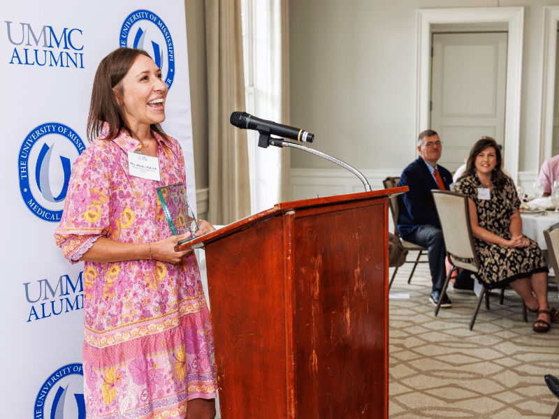 Nursing instructor Johnna Riddick thanks alumni after receiving the UMMC School of Nursing's Early Career Award.