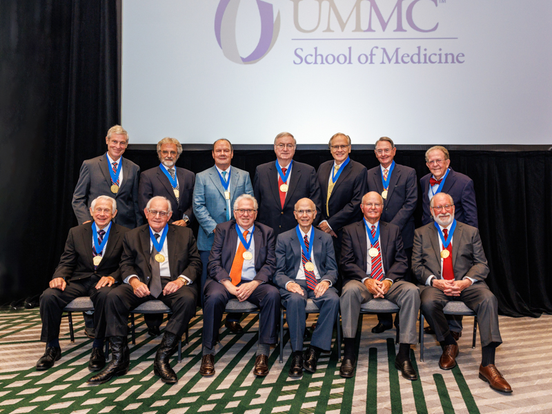 Golden Graduates, members of the 1974 School of Medicine Class present at the Medical Alumni Awards dinner are, from left, front row, Dr. Sheldon Johnson, Dr. Henry Bethea, Dr. Glenn Morris, Dr. John Abide, Dr. Chan Henry and Dr. William Cushman; back row, from left, Dr. John Purvis, Dr. Troy Watkins, Dr. Sam Cox, Dr. John Halbrook, Dr. William "Jim" Alexander, Dr. Robert Brahan and Dr. George Rodney Meeks.