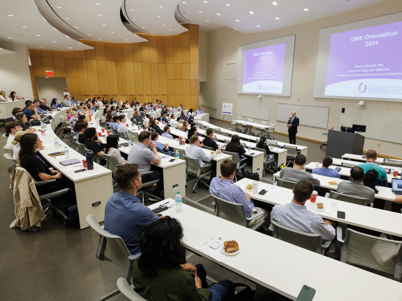Dr. Jimmy Stewart, associate dean for graduate medical education, welcomes new residents during orientation. Joe Ellis/ UMMC Communications 