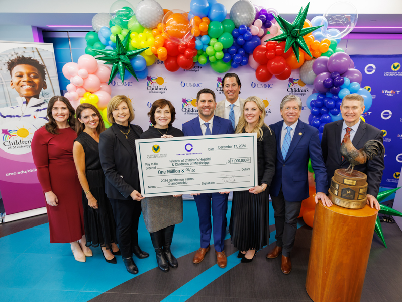 Celebrating the $1 million donation from Century Club Charities to Friends of Children's Hospital are, from left, Caitlin Foreman, executive director of Friends of Children's Hospital; Hilary Burroughs, vice president of marketing at Wayne-Sanderson Farms; Dr. LouAnn Woodward, vice chancellor for health affairs at UMMC; Dr. Mary Taylor, Suzan B. Thames Chair and professor of pediatrics; David Gadd, senior vice president at Wayne-Sanderson Farms and general manager of the company's retail business unit; Dr. JR Woodall, president of Century Club Charities; Kristin Allen, board chair of Friends of Children's Hospital; Steve Jent, executive director of the Sanderson Farms Championship; and Dr. Guy Giesecke, CEO of Children's of Mississippi. Joe Ellis/ UMMC Communications