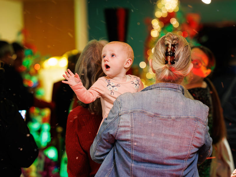 Children's of Mississippi patient Fanci Tuggle of Petal enjoys BankPlus Presents Winter Wonderland and Ace Tree Farm with her family. Melanie Thortis/ UMMC Communications