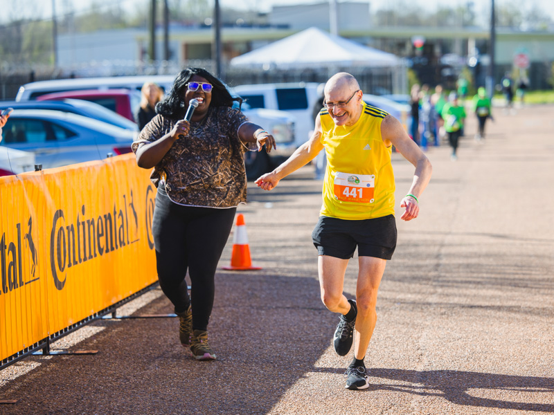 Philip Harizi of Jackson finishes the half marathon.
