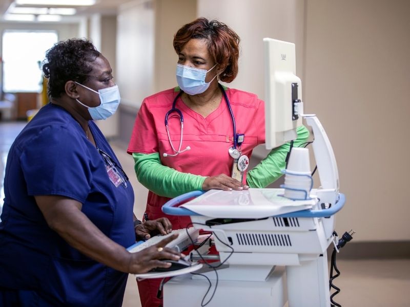 Benita Spann, nurse supervisor, with Queen Armstrong, inpatient RN, at UMMC Holmes County.