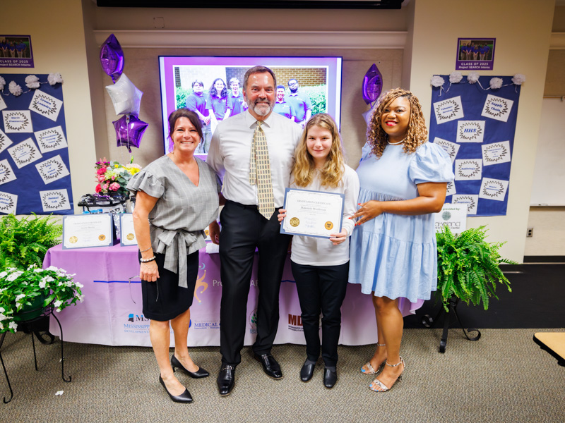 From left, Christina Guarino, lead instructor for UMMC’s program for the Rankin County School District; Tommy Burnham of Project SEARCH; Makenzie Westbrook, of Pearl, among seven who completed the program in 2025; and Jasmine Lee, a teaching assistant and job skills trainer in the program