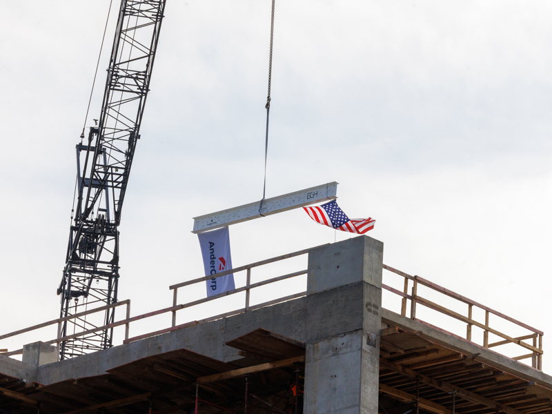 A beam adorned with flags and the signatures of nursing faculty is shown at the top of the new UMMC School of Nursing. Jay Ferchaud/ UMMC Communications