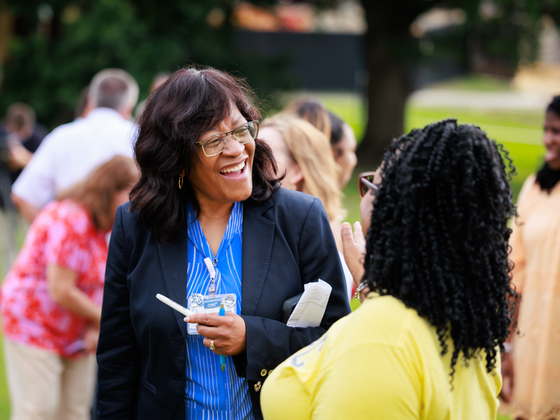Dr. Kristina Cherry, chief nursing executive at UMMC, talks with Susie Deloach, School of Nursing education administrator, at the topping-out ceremony. Joe Ellis/ UMMC Communications