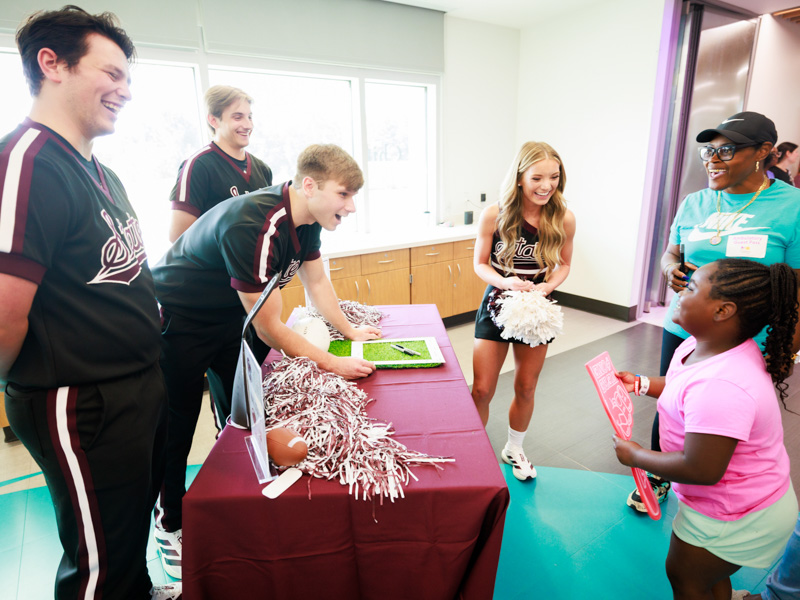 Children's of Mississippi Patient Zy'ion Meardry of Waynesboro meets cheerleaders from Mississippi State University. Joe Ellis/ UMMC Communications