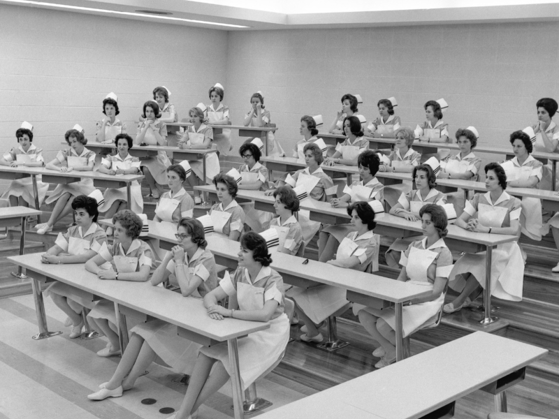 Students in the state’s first baccalaureate nursing program wear uniforms, complete with caps that signify their year, to class in this archive photo.