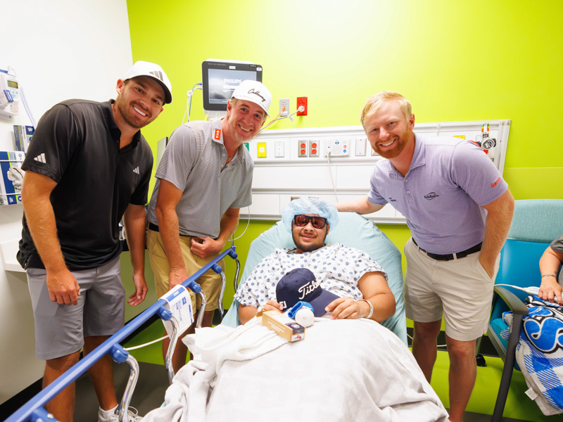 Sanderson Farms Championship pro-golfers, from left, Aaron Wise, Vince Covello and Anders Albertson tour the Children's of Mississippi pose with patient Joshua Townsend, 17, of Meridian.