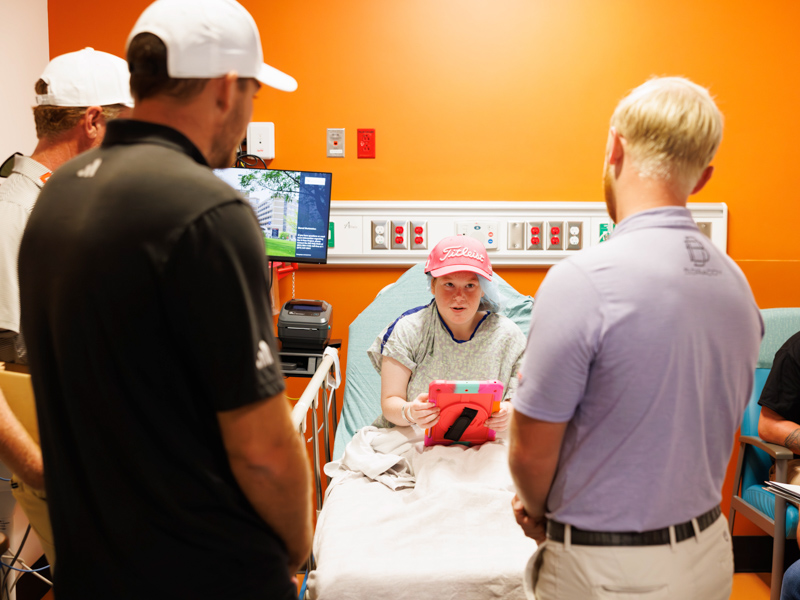 Addison Ivy, 17, of Union meets Sanderson Farms Championship pro-golfers, from left, Aaron Wise, Vince Covello and Anders Albertson.