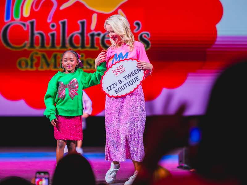 Asia Sherron wears a sparkling holiday outfit.