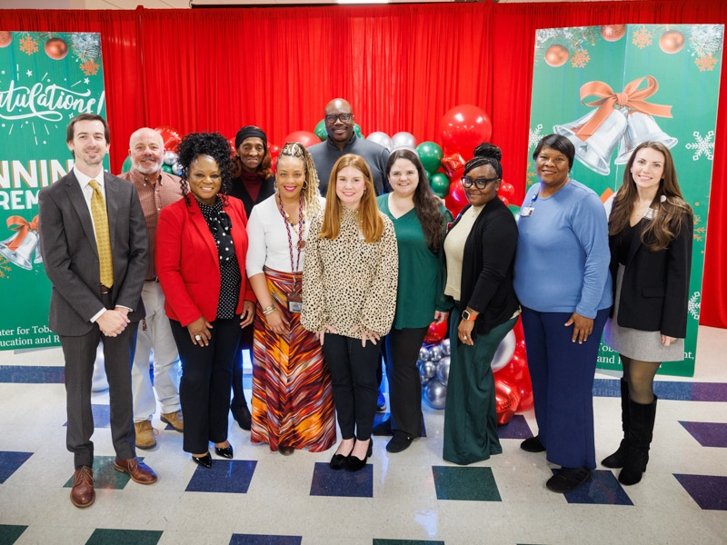 The ACT Center team poses for a photo, from left, [front row] Dr. Jonathan Hontzas, director; Sharon Terry, tobacco treatment specialist; Kelli Grant, manager of research operations; Brittany Tichenor, tobacco treatment specialist; Erica Cameron, lung cancer screening coordinator; Latoya Scott, scheduler; Stacy Wilson, medical office assistant; Leslie Musshafen, associate director of administration for the Cancer Center & Research Institute; [back row] Langston Moore, project manager for the Cancer Center & Research Institute; Kathy Banks, administrative assistant; and Jay Thompson, project manager.
