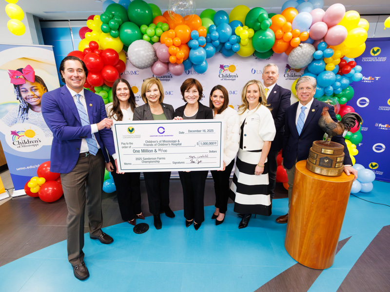 Celebrating the $1 million donation from the 2025 Sanderson Farms Championship are, from left, Dr. JR Woodall, Century Club president and an assistant professor of orthopaedic surgery; Friends of Children's Hospital executive director Caitlin Foreman; Dr. LouAnn Woodward, vice chancellor for health affairs; Dr. Mary Taylor, Suzan B. Thames Chair of Pediatrics and CEO of Children's of Mississippi; Hilary Burroughs, Wayne-Sanderson Farms vice president of marketing; Mary Clift Abdalla, Friends of Children's Hospital board chair; Kevin McDaniel, Wayne-Sanderson Farms CEO; and Steve Jent, executive director of the Sanderson Farms Championship.