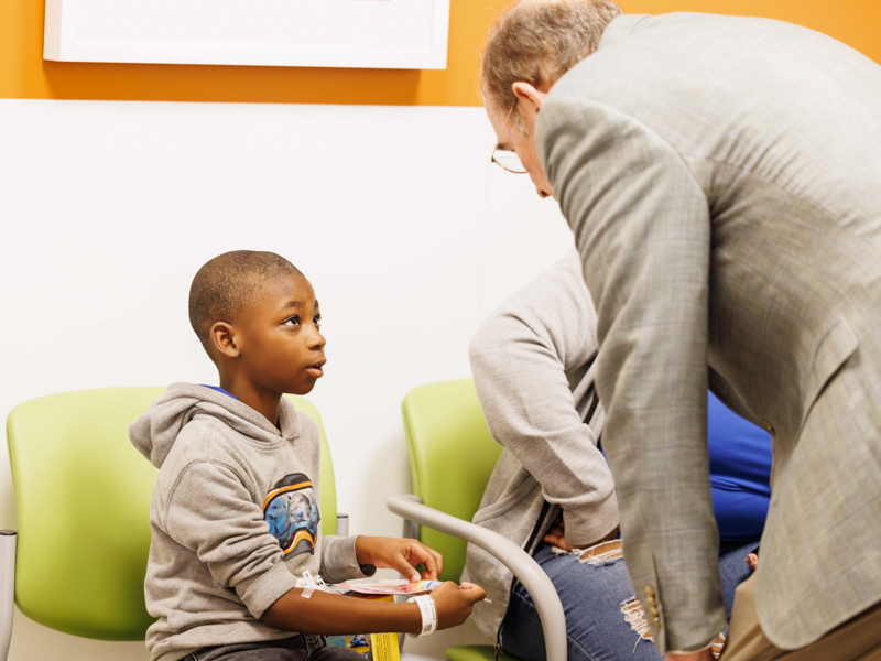 Deylin Harris, 8, of Brandon visits with Lt Governor Delbert Hosemann. Melanie Thortis/ UMMC Communications