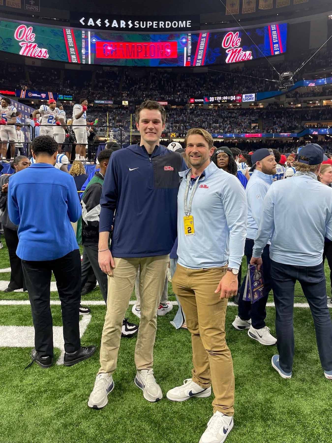 Ethan Brown, left, a PT resident with the Ole Miss football program in 2025, with Dr. Jacob Daniels, assistant professor in Physical Therapy at SHRP, enjoy a winning moment at the 2026 College Football Playoff Quarterfinal at the Allstate Sugar Bowl.