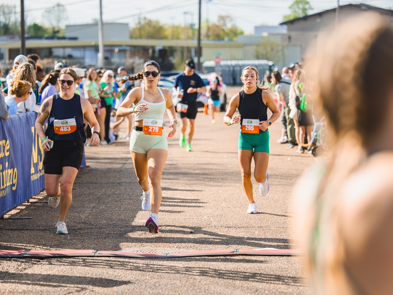 Half marathon runners race to the finish line at the 2026 Run the Rainbow benefitting Children's of Mississippi.