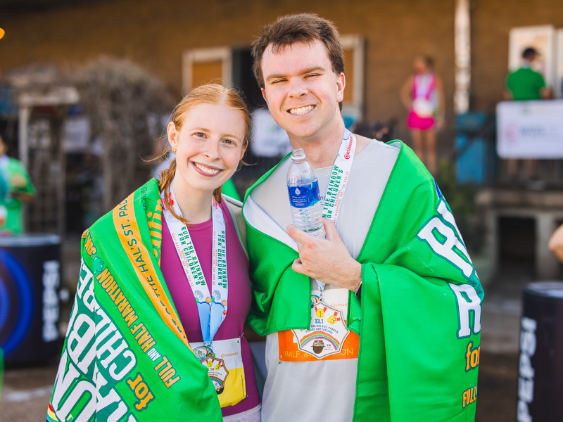 UMMC School of medicine M3 students Carly Kendrick, 10k runner and Austin Lane, half marathon runner pose with their 2026 Run the Rainbow finisher medals for the 2026 Run the Rainbow benefitting Children's of Mississippi.