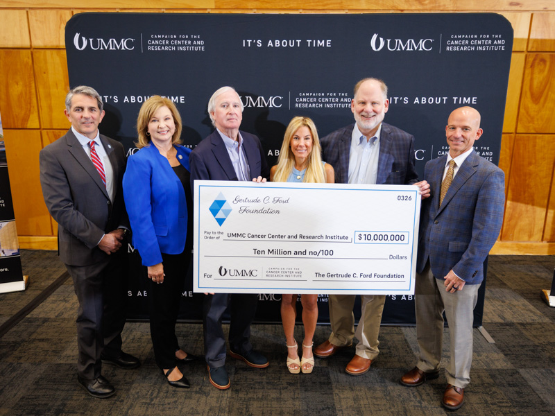 Smiling with a $10 million gift from the Gertrude C. Ford Foundation are, from left, Dr.  Rod Rocconi, Ergon Chair for Cancer Research and CCRI director; Dr. LouAnn Woodward, vice chancellor for health affairs; Stephen Sims, president of the Gertrude C. Ford Foundation; Mary Catherine Blackwell, secretary of the Gertrude C. Ford Foundation; John Lewis, treasurer of the Gertrude C. Ford Foundation; and Dr. Alan Jones, associate vice chancellor for health affairs.