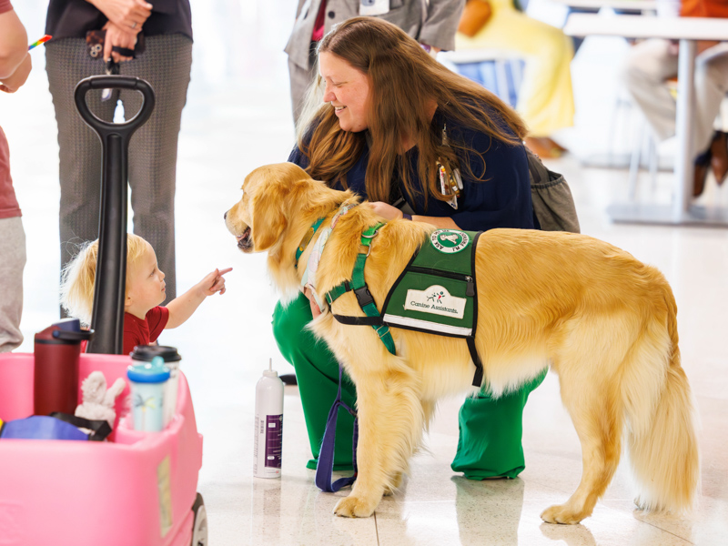Olivia Aldrich, child life manager at Children's of Mississippi, introduces Riggins Greer of Canton to Hollywood at the Petite Parade for St. Patrick's Day. Melanie Thortis/ UMMC Communications