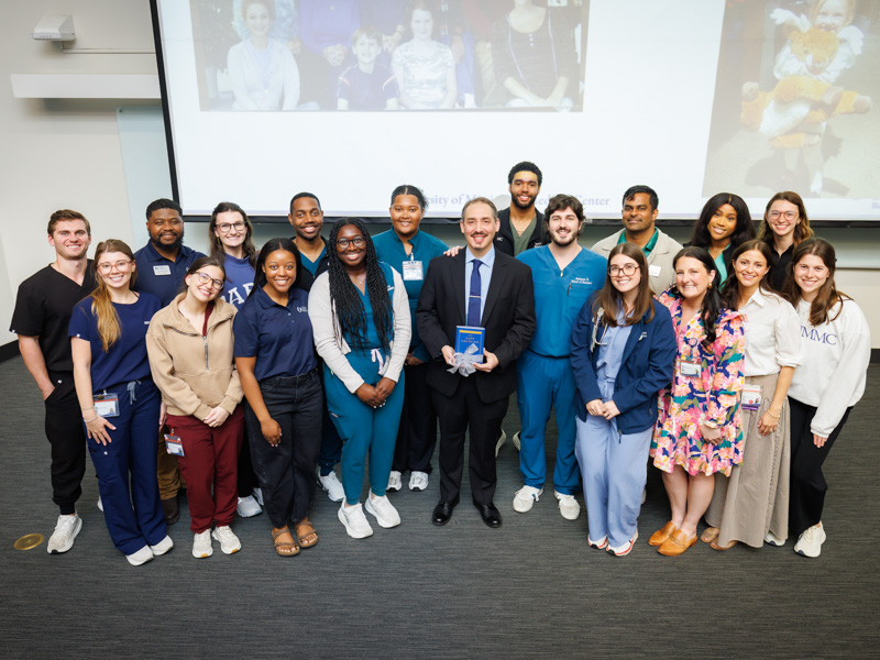 After delivering his Last Lecture, Dr. Nathan Tullos celebrates with student leaders from the Associated Student Body and Student Alumni Representatives who chose him as keynote speaker.