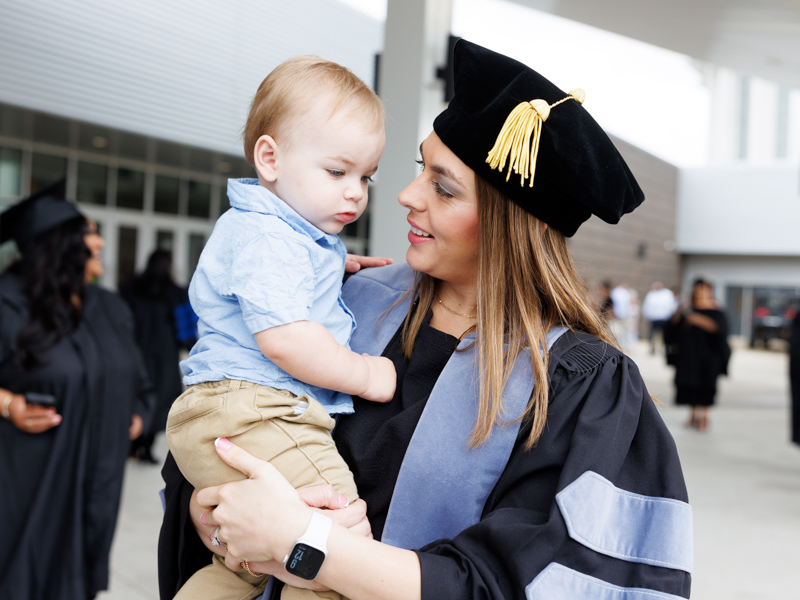 Occupational therapy graduate Brittany Coleman shares the spotlight with her 1-year-old son Lane.
