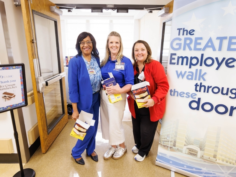 Dr. Kristina Cherry, right, UMMC chief nursing executive, Denise Rochelle, nurse recruitment manager with talent acquisition, and Lindsey Briscoe, director of clinical services at University Heart, pass out ice cream sandwhiches to employees as part of Employee Appreciation Week. Melanie Thortis/ UMMC Communications