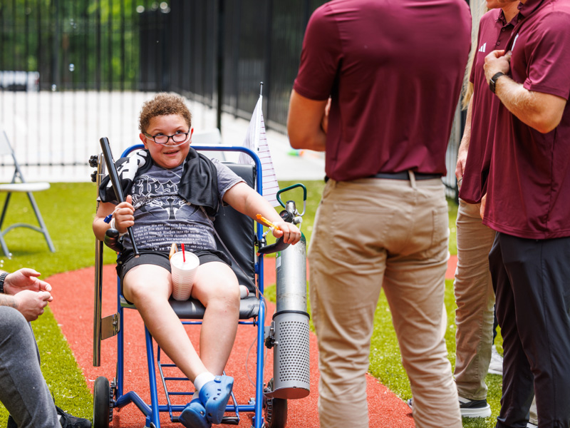 Nolan Jenkins, 10, of Ridgeland holds a souvenir from MSU baseball players.